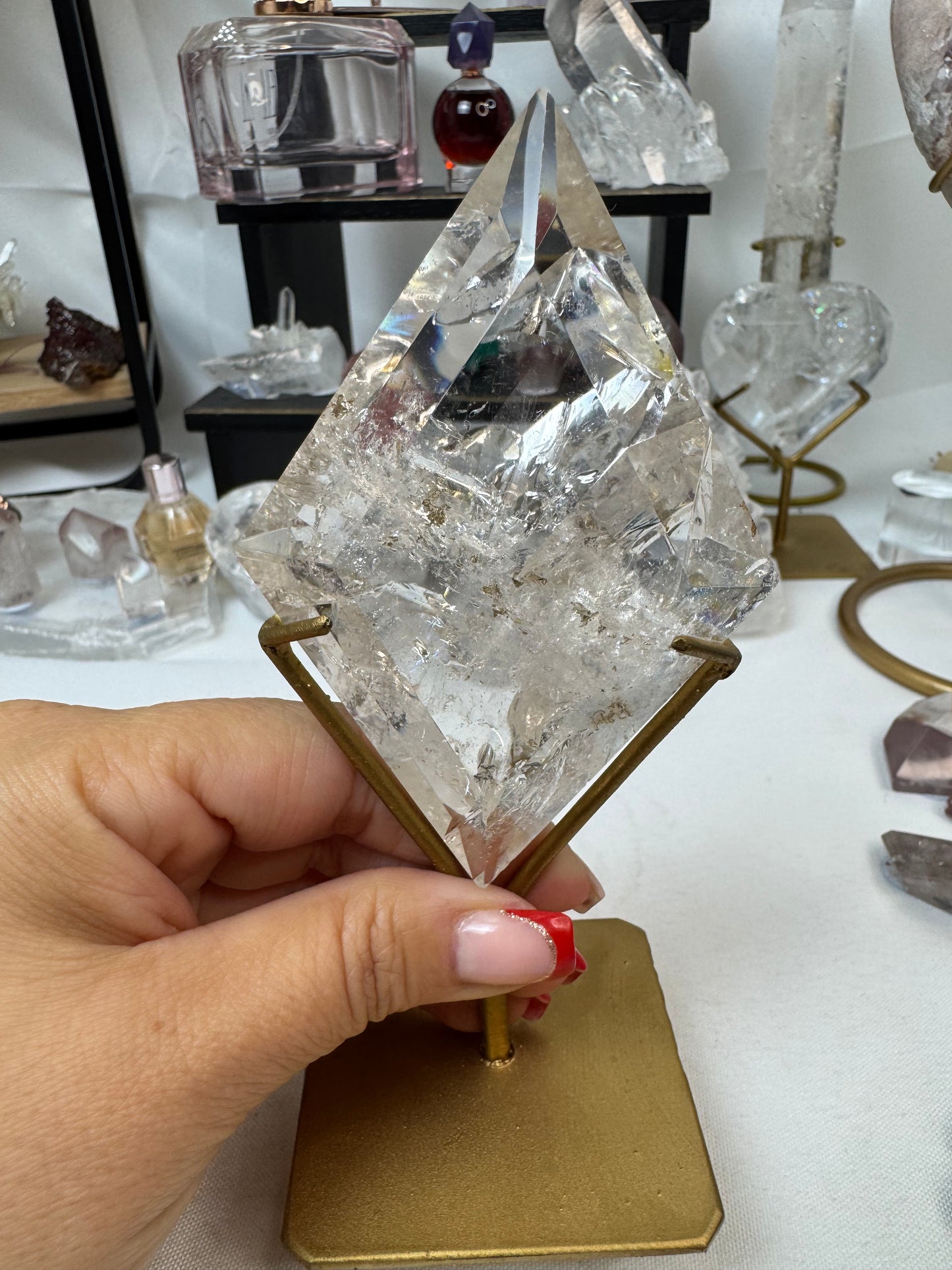 Clear Quartz Diamond Crystal on gold stand